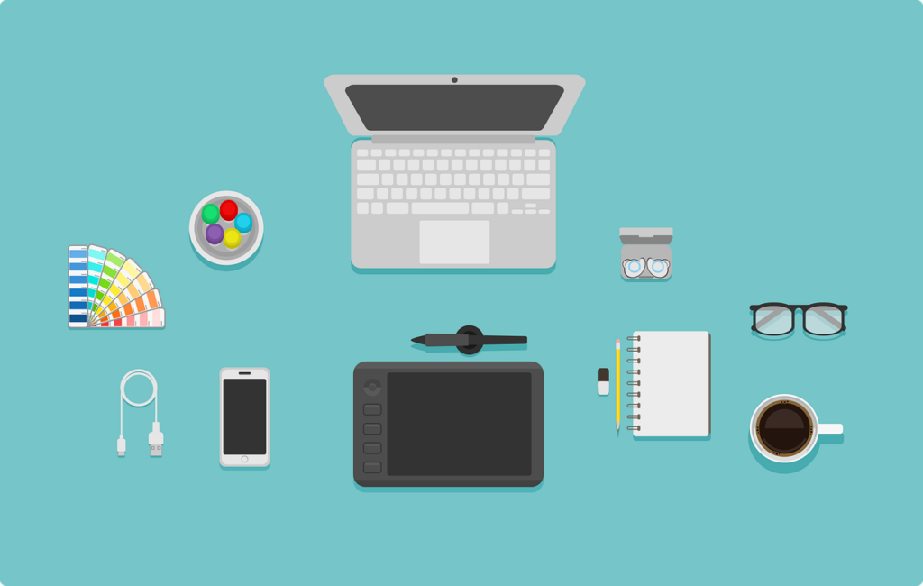 Graphic designer desk with supplies laid out